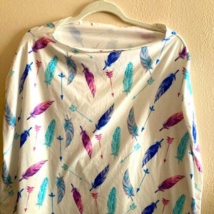 Cream and multi colored feather car seat cover